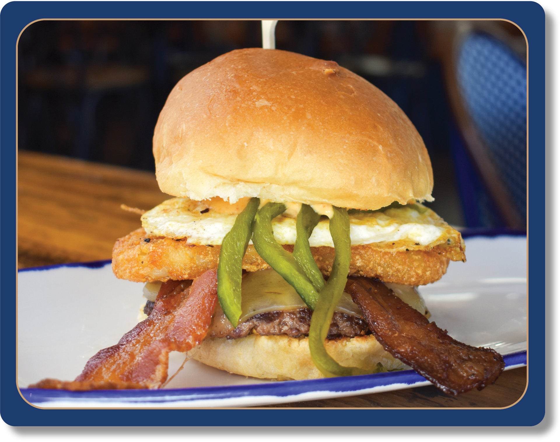 Hangover Burger: 4 oz House Ground Oregon Natural Grass Fed Beef Patty, Bacon, Fried Egg, Hashbrown, Green Chilis, Chipotle Aioli, Pepperjack Cheese, Toasted Big Ed’s Potato Bun