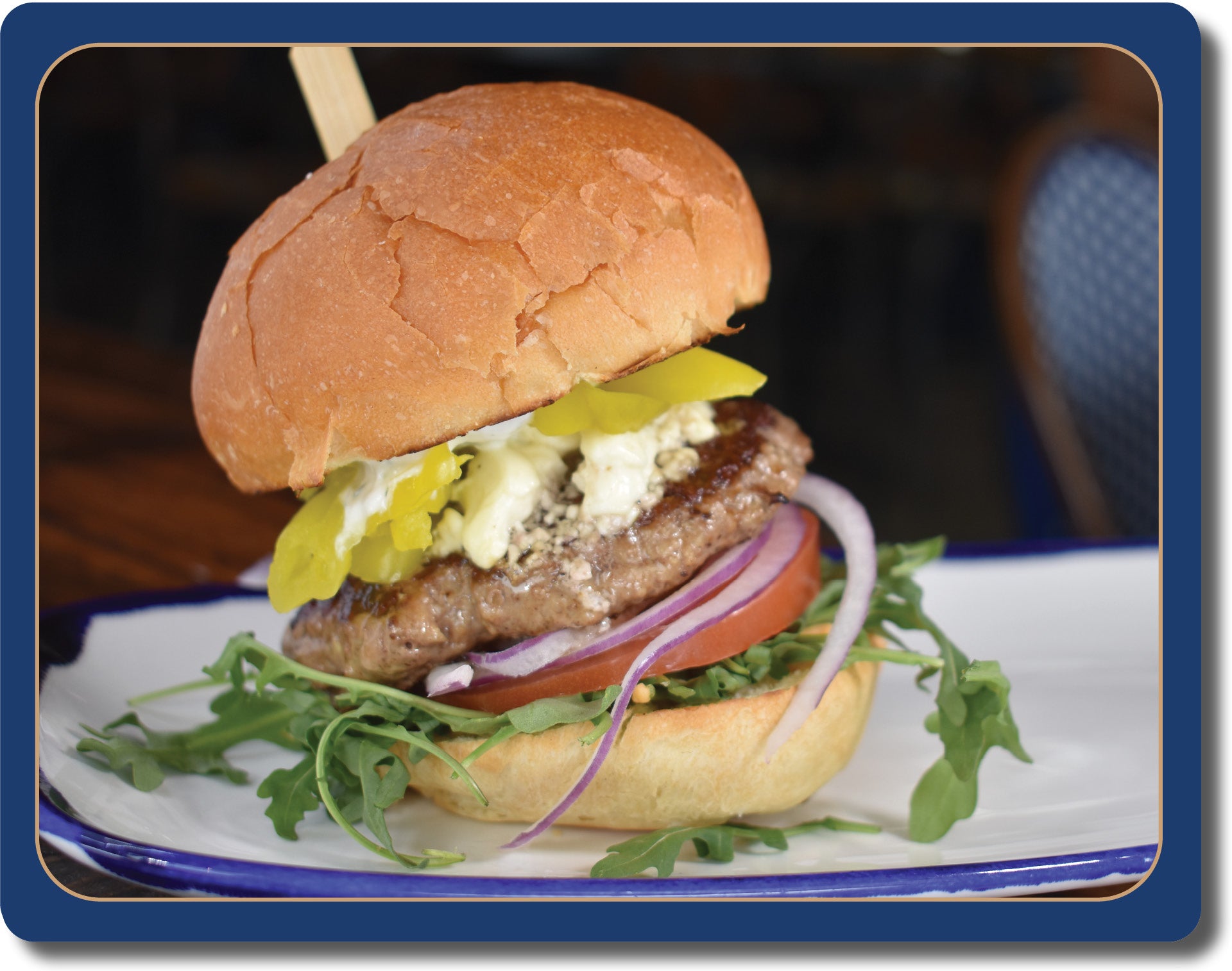 North 44 Lamb Burger: 4 oz Grass Fed Ground Lamb Burger, Arugula, Tomato, Red Onion, Pepperoncini, Hummus, Tzatziki, Feta Cheese.